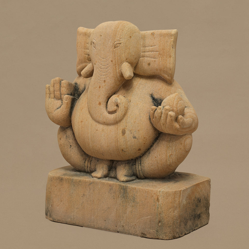 Right angle view of 11 inch Lord Ganesh statue handcrafted in yellow sandstone