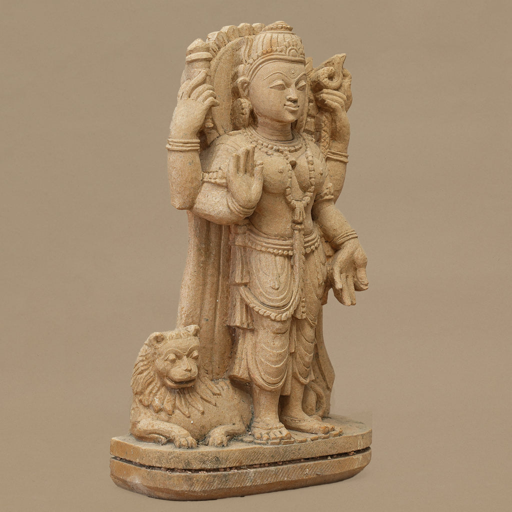 Left angle view of 11.5 inch Goddess Durga statue handcrafted in yellow sandstone