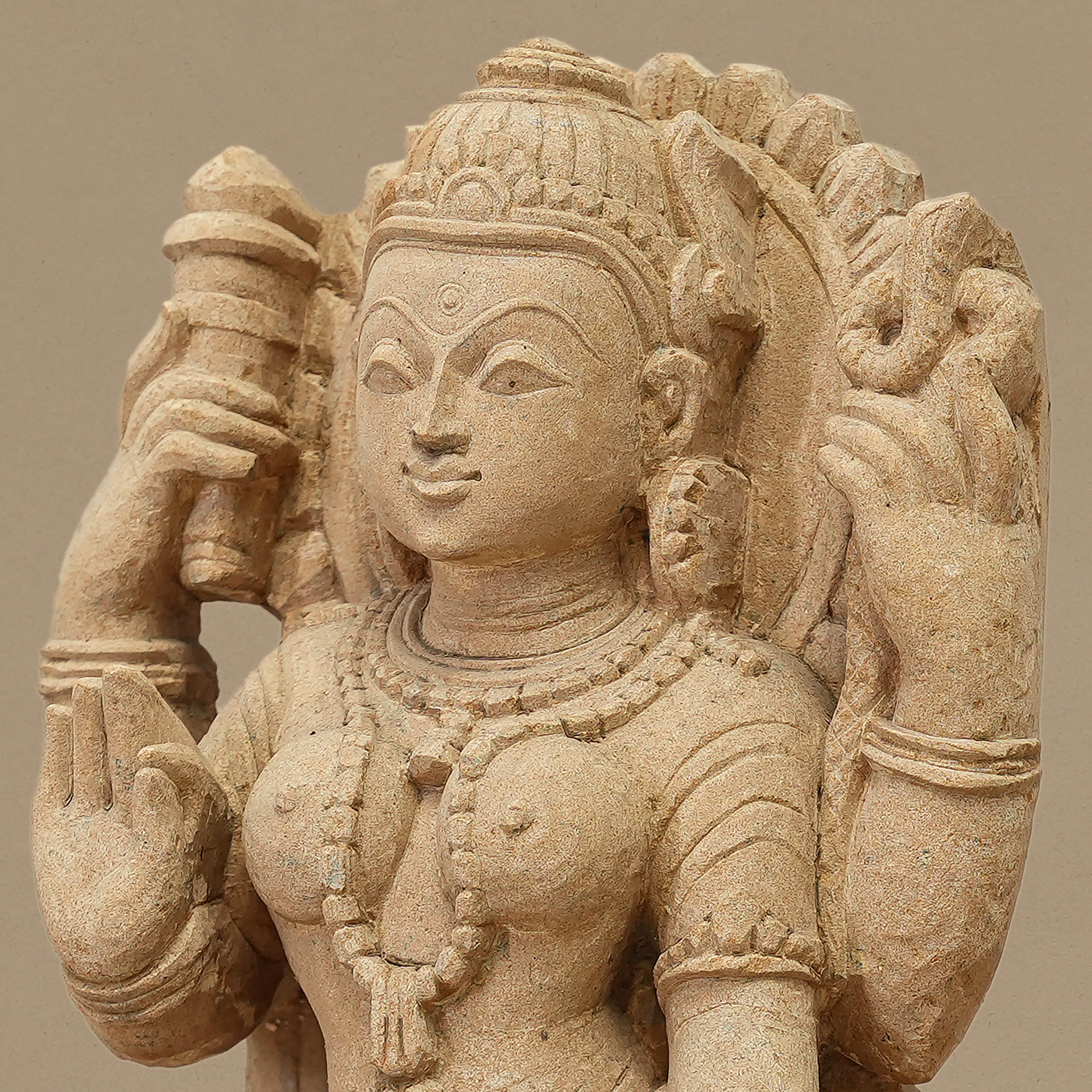Zoomed in view of 11.5 inch Goddess Durga statue handcrafted in yellow sandstone