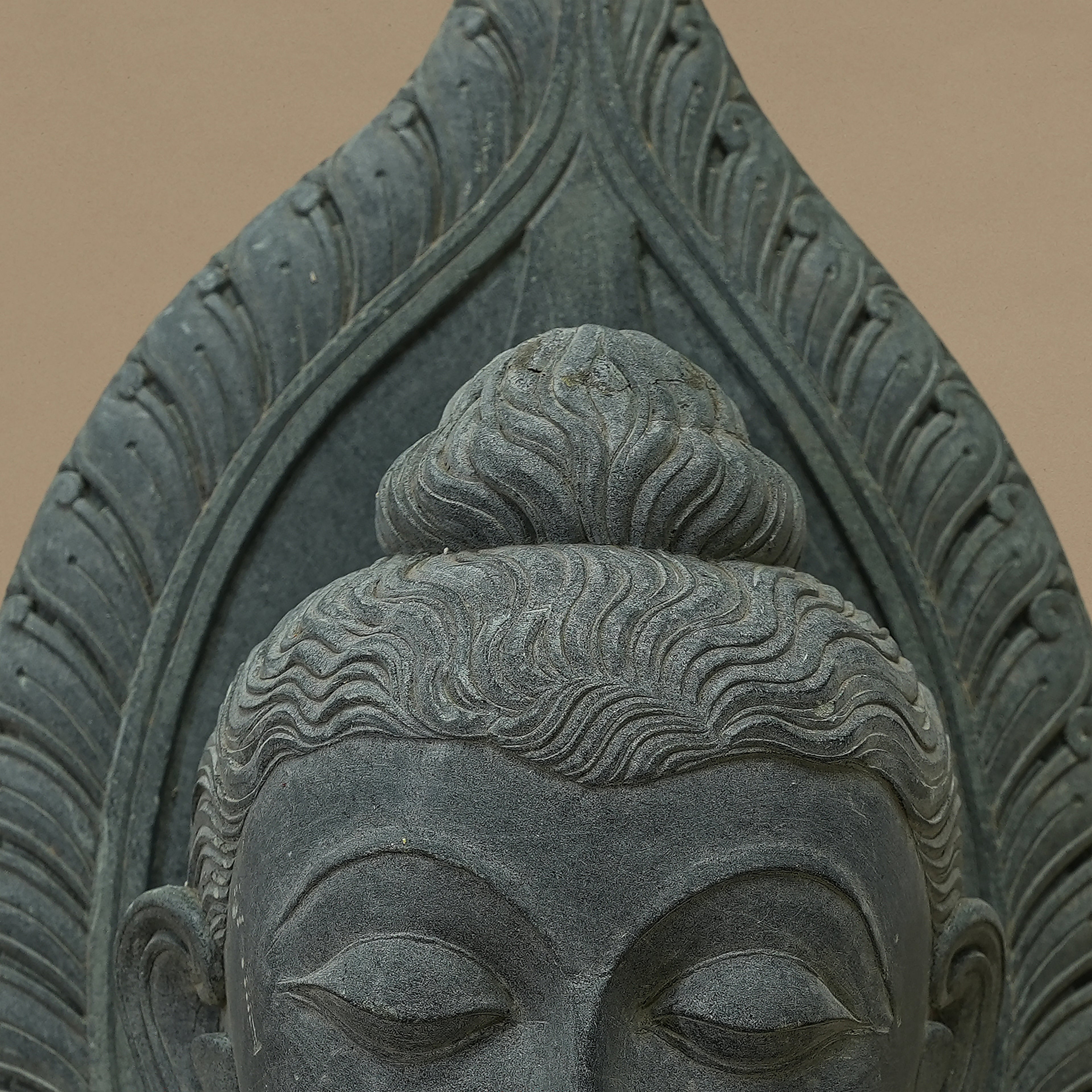 Close up view of the bust of Lord Buddha handcrafted from Dungarpur black stone