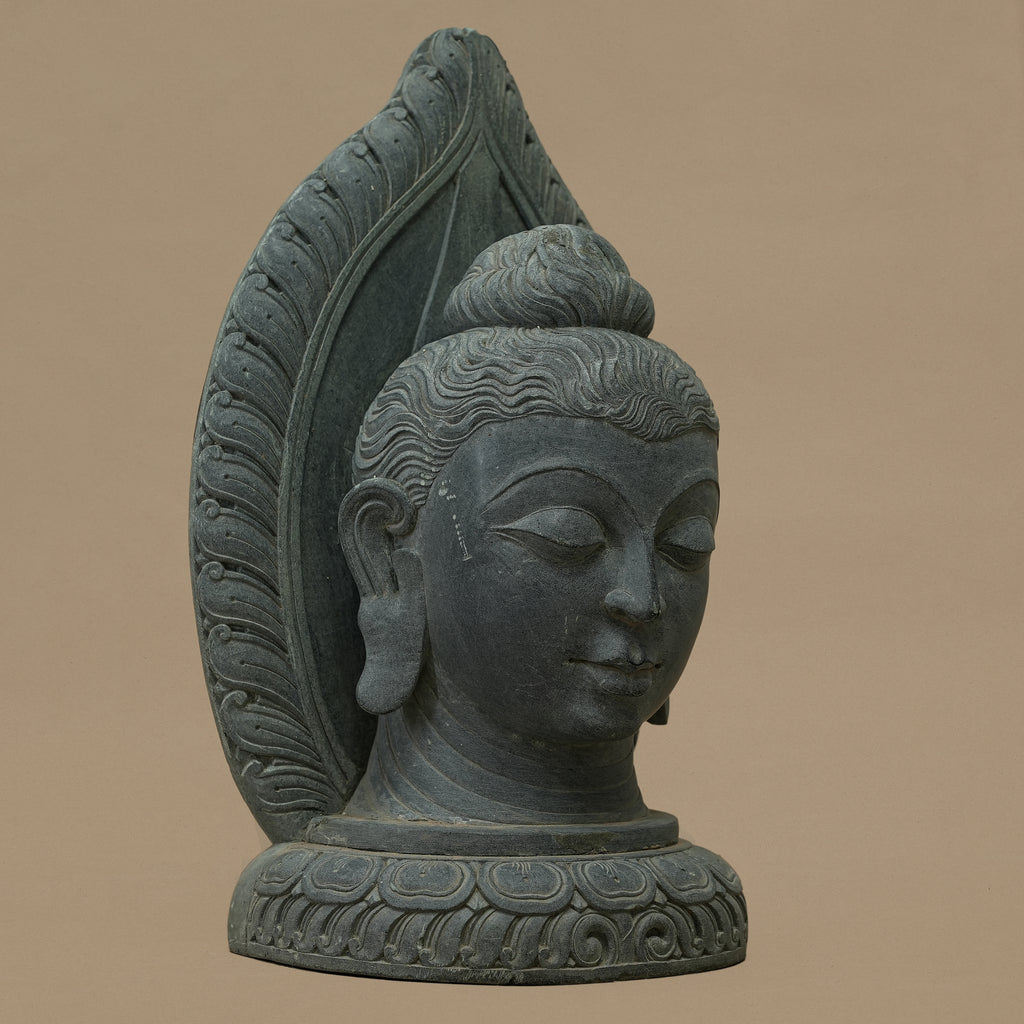 Left angle view of the bust of Lord Buddha handcrafted from Dungarpur black stone