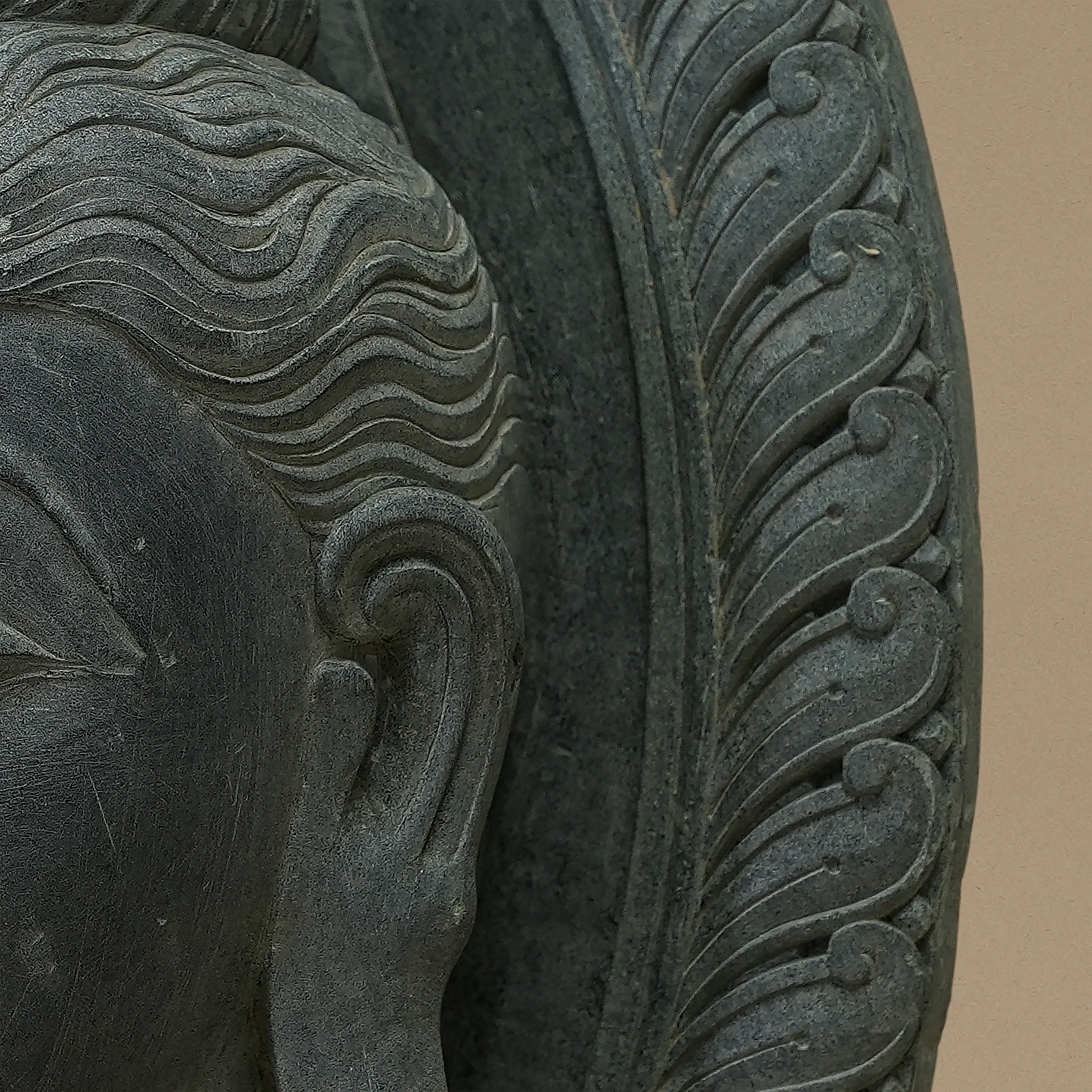 Side close up view of the bust of Lord Buddha handcrafted from Dungarpur black stone