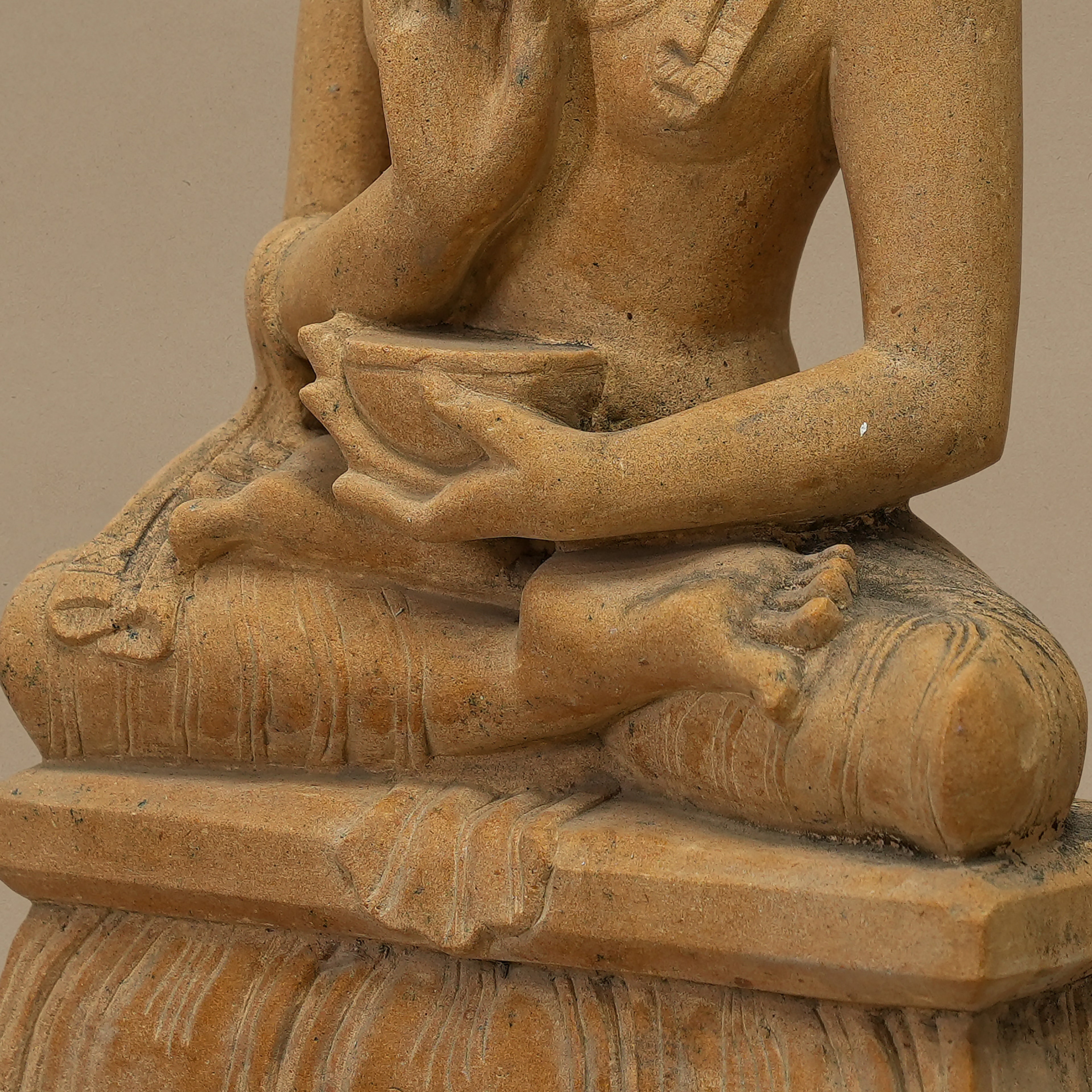 Base view of 12 inch Lord Buddha statue handcrafted from yellow sandstone for home decor