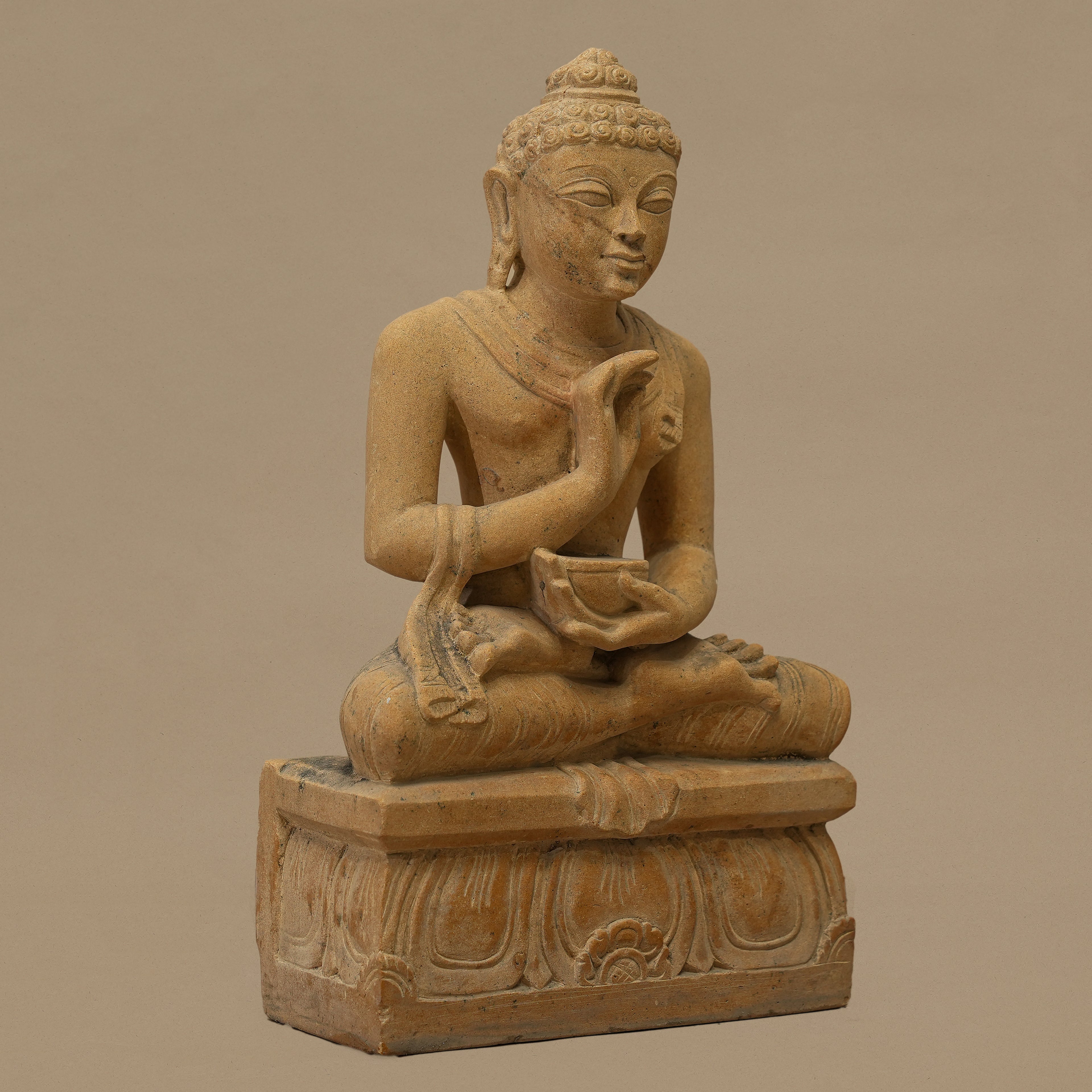 Left view of 12 inch Lord Buddha statue handcrafted from yellow sandstone for home decor